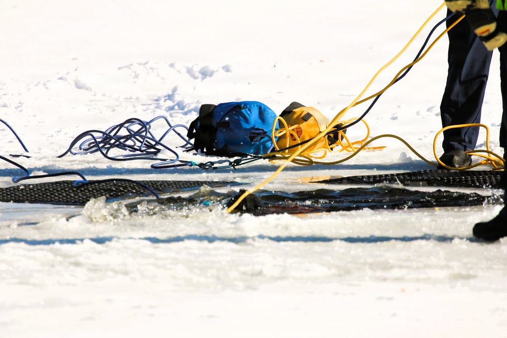 Fort McCoy firefighters practice diving under ice at post’s Big Sandy Lake during February 2026 training