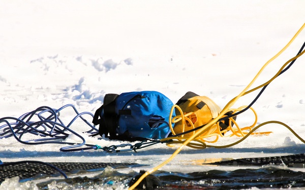 Fort McCoy firefighters practice diving under ice at post’s Big Sandy Lake during February 2026 training