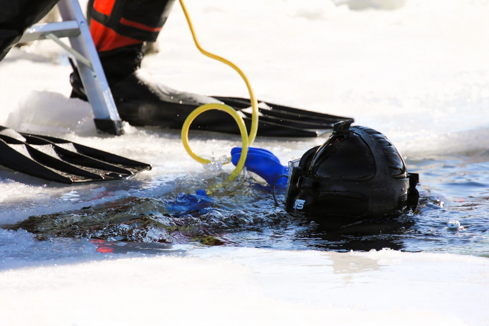 Fort McCoy firefighters practice diving under ice at post’s Big Sandy Lake during February 2026 training
