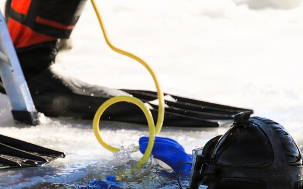 Fort McCoy firefighters practice diving under ice at post’s Big Sandy Lake during February 2026 training