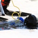 Fort McCoy firefighters practice diving under ice at post’s Big Sandy Lake during February 2026 training