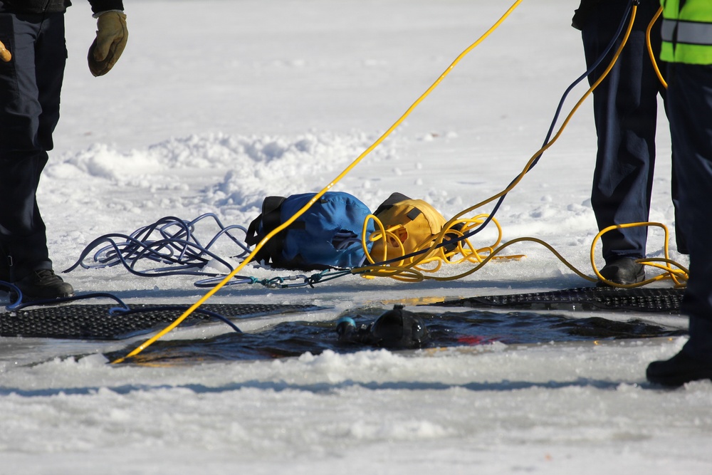 Fort McCoy firefighters practice diving under ice at post’s Big Sandy Lake during February 2026 training