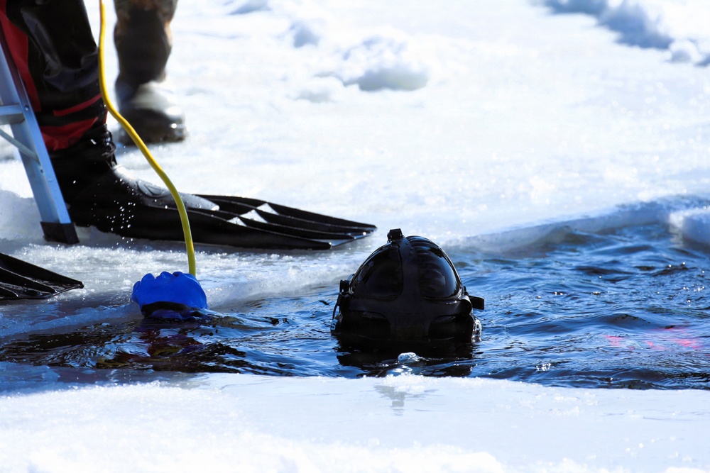 Fort McCoy firefighters practice diving under ice at post’s Big Sandy Lake during February 2026 training