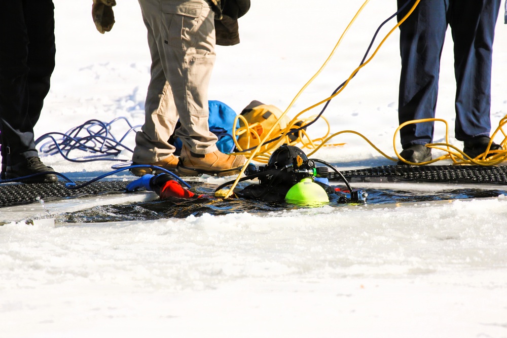 Fort McCoy firefighters practice diving under ice at post’s Big Sandy Lake during February 2026 training
