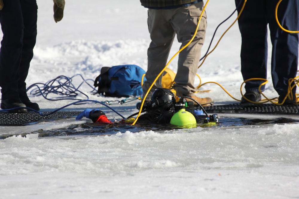 Fort McCoy firefighters practice diving under ice at post’s Big Sandy Lake during February 2026 training