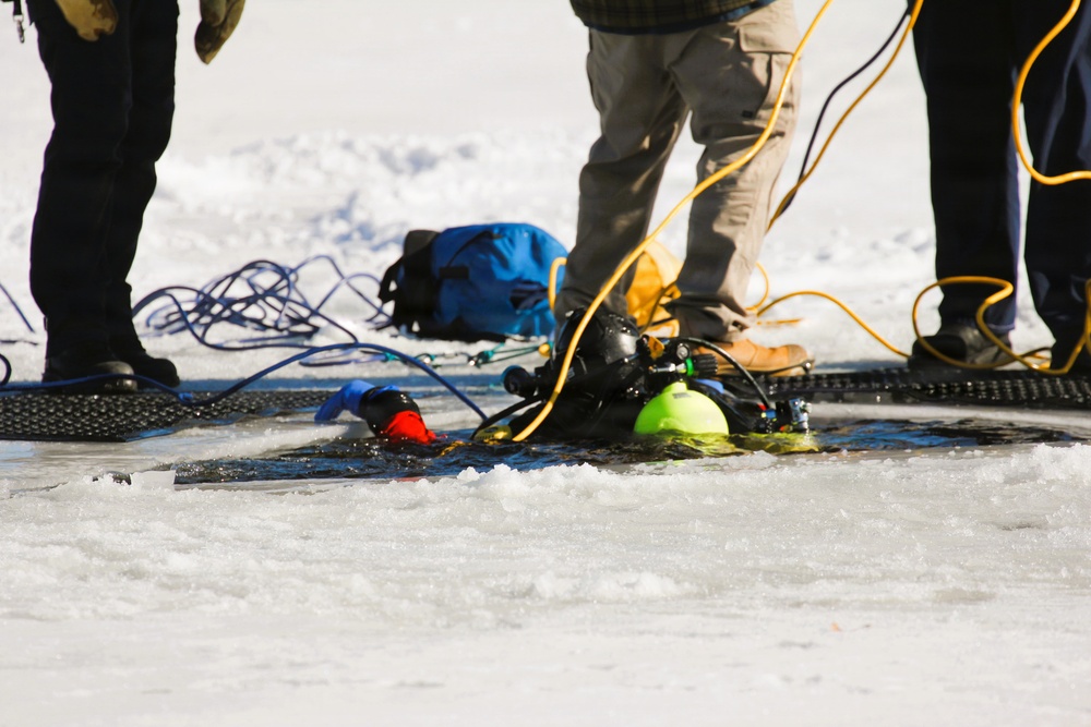 Fort McCoy firefighters practice diving under ice at post’s Big Sandy Lake during February 2026 training