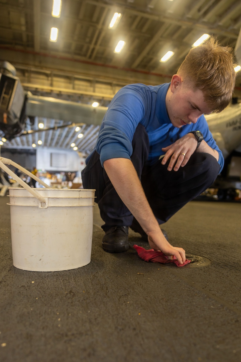 USS Iwo Jima Sailors Cleans the Hangar Bay