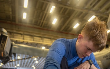 USS Iwo Jima Sailors Cleans the Hangar Bay