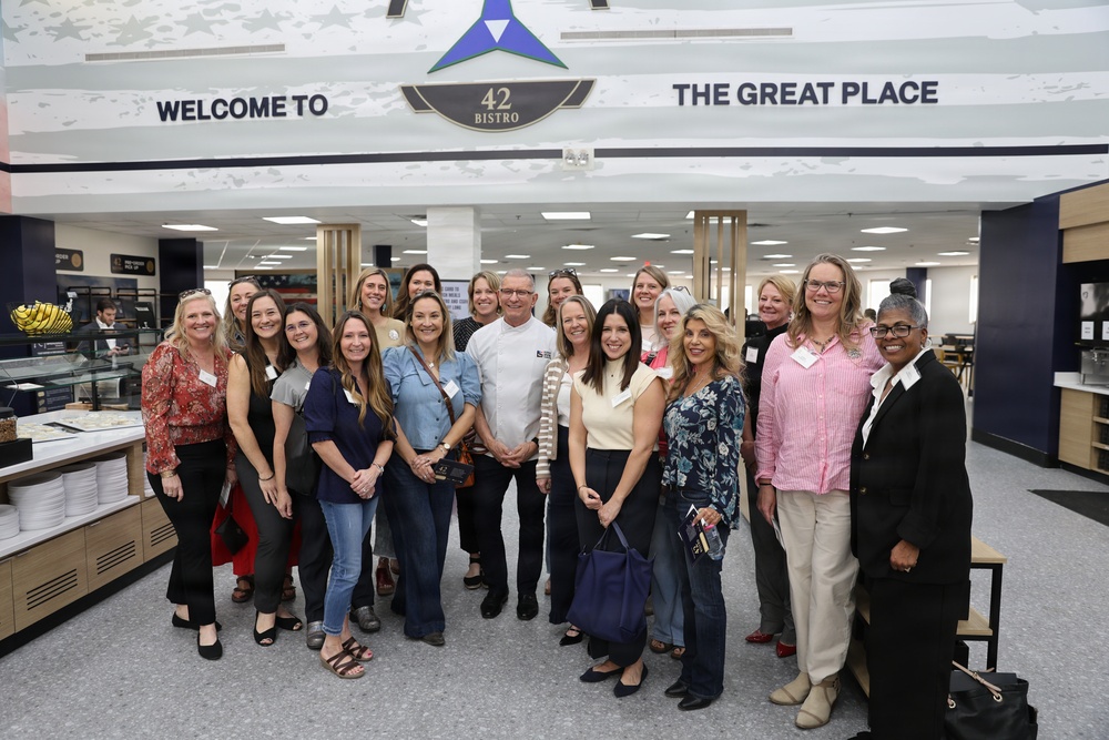 Military Spouses Pose for Photo with Chef Robert Irvine at 42 Bistro