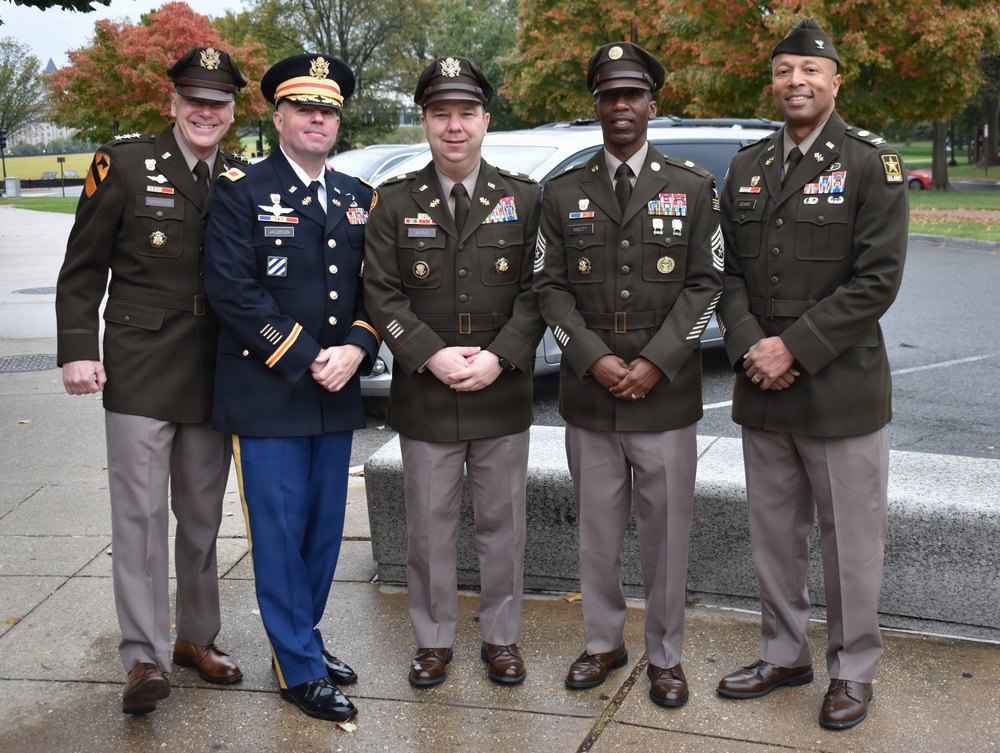LTG John Morrison Jr., the Deputy Chief of Staff, G-6, speaks to a group of Honor Flight Service Members at the World War II Memorial