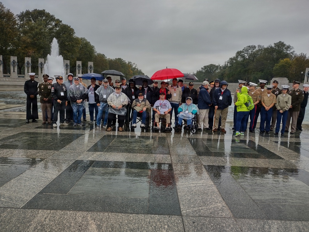 LTG John Morrison Jr., the Deputy Chief of Staff, G-6, speaks to a group of Honor Flight Service Members at the World War II Memorial
