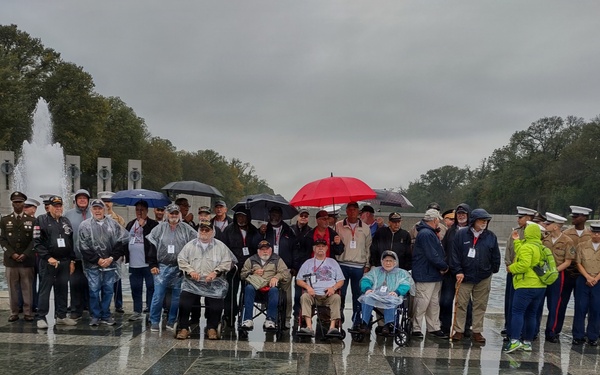 LTG John Morrison Jr., the Deputy Chief of Staff, G-6, speaks to a group of Honor Flight Service Members at the World War II Memorial