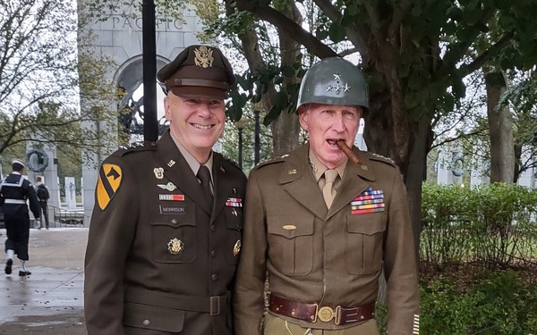 LTG John Morrison Jr., the Deputy Chief of Staff, G-6, speaks to a group of Honor Flight Service Members at the World War II Memorial