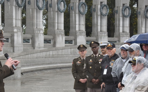LTG John Morrison Jr., the Deputy Chief of Staff, G-6, speaks to a group of Honor Flight Service Members at the World War II Memorial