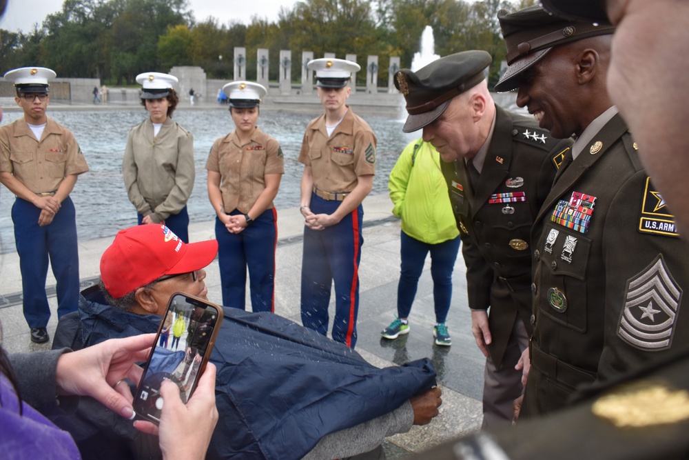 LTG John Morrison Jr., the Deputy Chief of Staff, G-6, speaks to a group of Honor Flight Service Members at the World War II Memorial