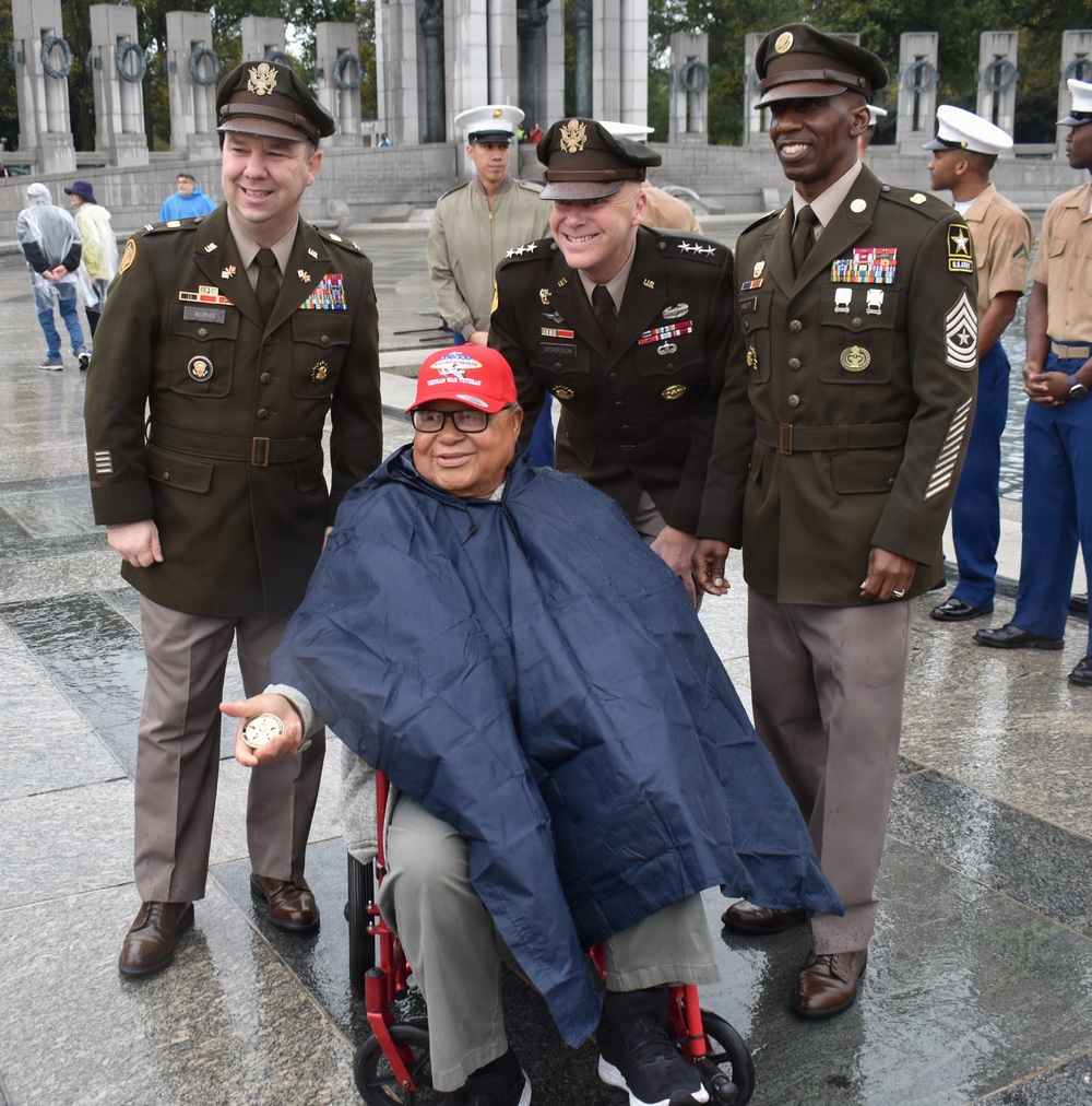 LTG John Morrison Jr., the Deputy Chief of Staff, G-6, speaks to a group of Honor Flight Service Members at the World War II Memorial