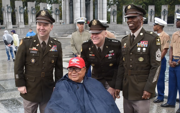 LTG John Morrison Jr., the Deputy Chief of Staff, G-6, speaks to a group of Honor Flight Service Members at the World War II Memorial