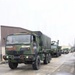 Heavy transport vehicles move out during large-scale convoy operation