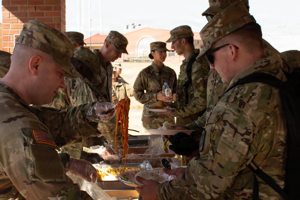 CPT Oswald and 6-52 Serve Food to fellow soldiers.