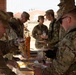 CPT Oswald and 6-52 Serve Food to fellow soldiers.