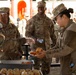 SPC KIM Receives food from fellow soldiers.