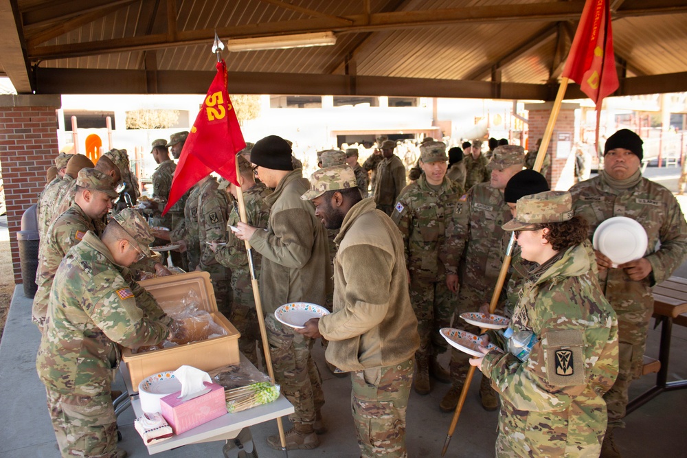 Wideshot of soldiers receiving chow at 35th ADA State of Brigade.