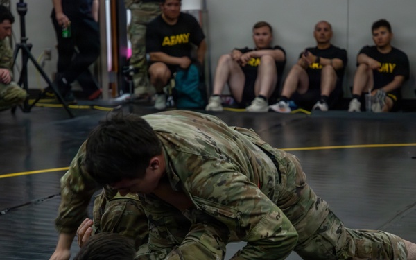 1st Armored Division Soldiers compete in Torch Week Combatives Competition Day