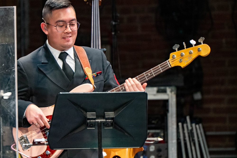 Musician 1st Class Grant Le performs at the Patriots Theatre at Trenton War Memorial during the US Navy Bands Sea Chanters National Tour