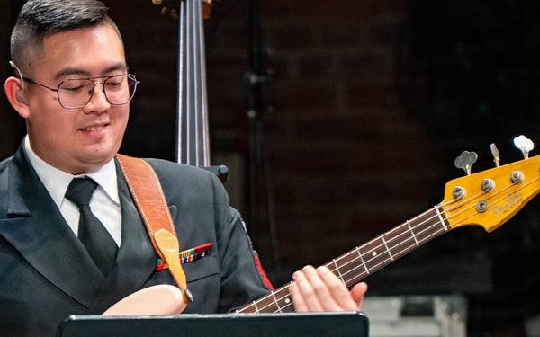 Musician 1st Class Grant Le performs at the Patriots Theatre at Trenton War Memorial during the US Navy Bands Sea Chanters National Tour