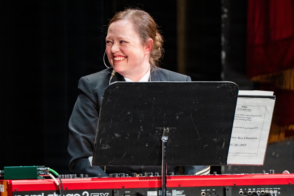 Senior Chief Musician Caroline Evans performs at the Patriots Theatre at Trenton War Memorial during the US Navy Bands Sea Chanters National Tour