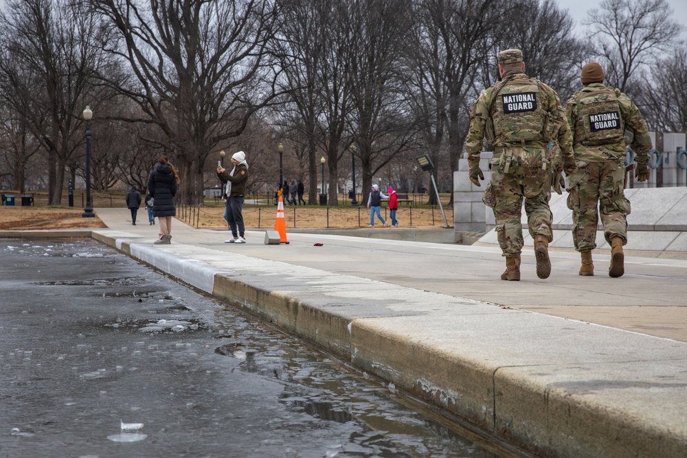 Mississippi National Guard Soldiers patrol in front of the Lincoln Memorial Reflecting Pool