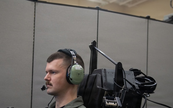 Student Naval Aviator Trains Using Simulator
