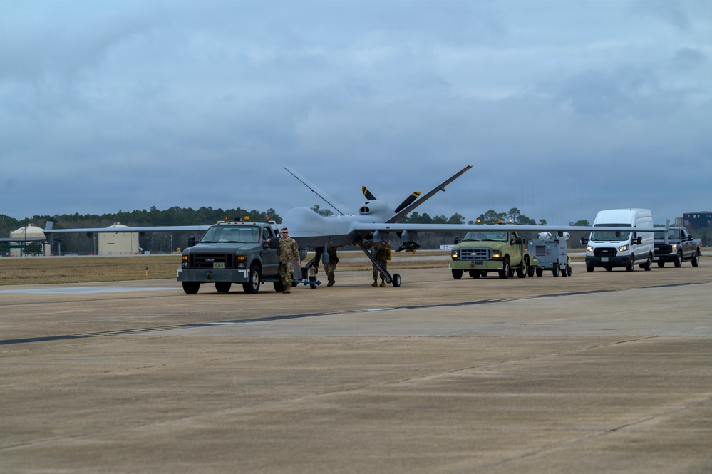 174th Attack Wing escorts MQ-9 Reaper for Hellfire loading during Sentry South 26-2