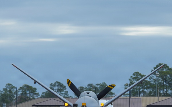 MQ-9 Reaper escorted for AGM-114 Hellfire loading during Sentry South 26-2