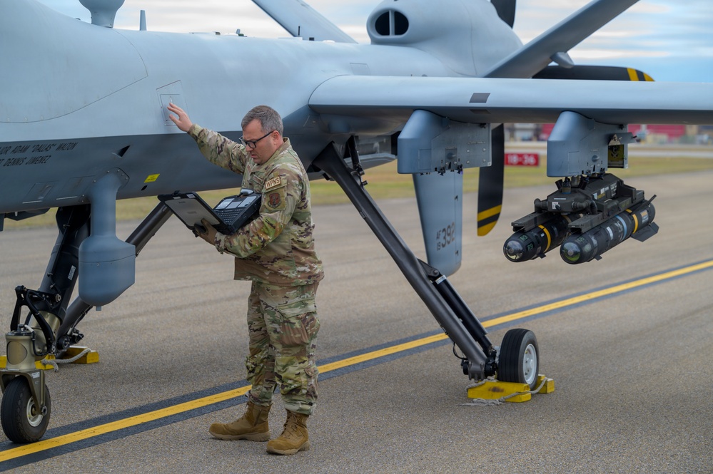 174th Attack Wing specialist checks MQ-9 Reaper data during Sentry South 26-2