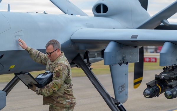 174th Attack Wing specialist checks MQ-9 Reaper data during Sentry South 26-2