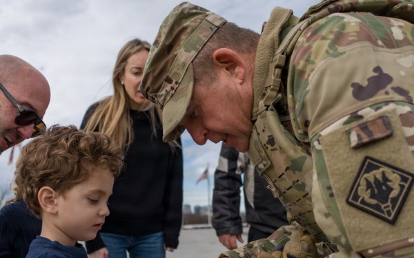 Mississippi National Guard Adjutant General gives a coin to a member of the public