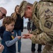 Mississippi National Guard Adjutant General gives a coin to a member of the public