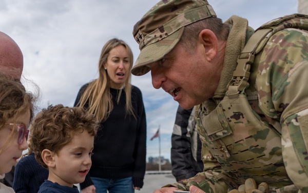 Mississippi National Guard Adjutant General gives a coin to a member of the public