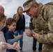 Mississippi National Guard Adjutant General gives a coin to a member of the public