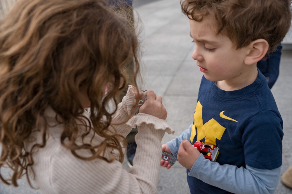 Mississippi National Guard Adjutant General gives a coin to a members of the public