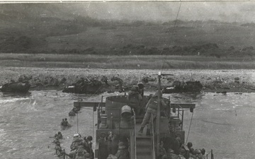 US Army Infantry Disembark From Bow of USS LCI(L) 412 at Omaha Beach, Normandy, France on D-Day