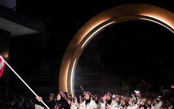 Sgt. Frank Del Duca carries the flag for the Opening Ceremonies for the 2026 Winter Olympics