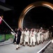 Sgt. Frank Del Duca carries the flag for the Opening Ceremonies for the 2026 Winter Olympics