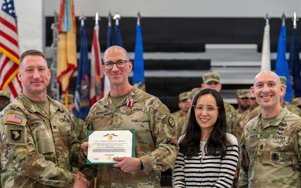 Maj. Jason A. Reinhardt, outgoing commander of the 498th Combat Sustainment Support Battalion (CSSB) received the Meritorious Service Medal from Col. R. Scott Carpenter, MSC-K commander prior to a Change of Command Ceremony at Camp Carroll on March 3.