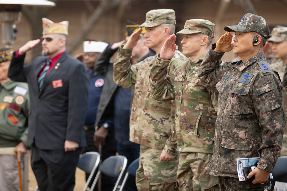 Major General Kim of ROKAF and Soldiers of USAF Salute the Flag at the Hill 180 Ceremony