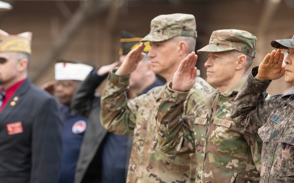 Major General Kim of ROKAF and Soldiers of USAF Salute the Flag at the Hill 180 Ceremony
