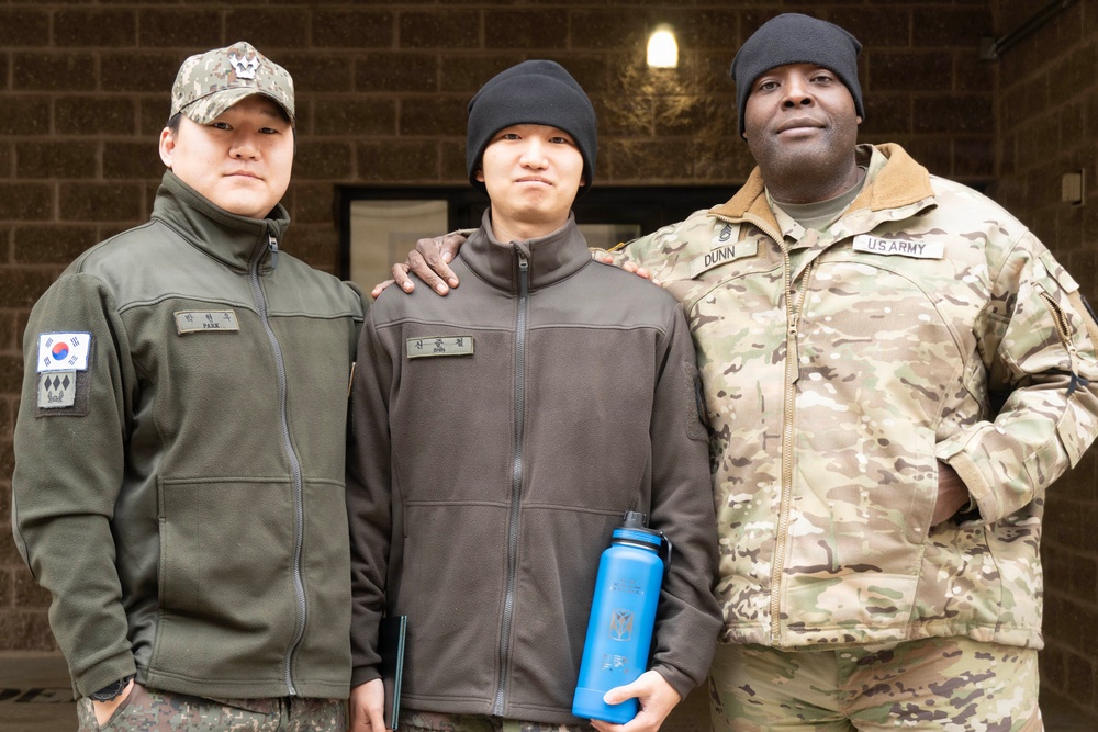 Captain Park and Sergeant First Class Dunn pose during Sergeant Shin's ETS ceremony.