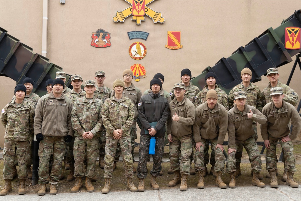 Sergeant Shin and KATUSA Soldiers pose for a group photo after his ETS cereomony.