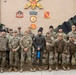 Sergeant Shin and KATUSA Soldiers pose for a group photo after his ETS cereomony.